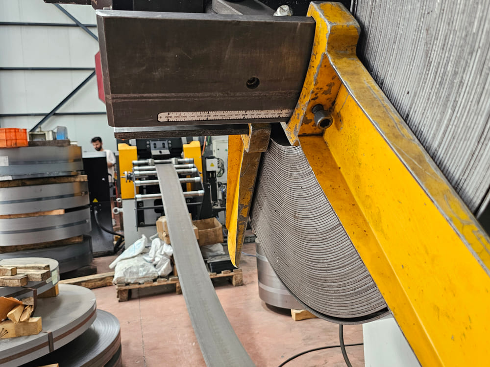 Strip running off the decoiler into the press feed line